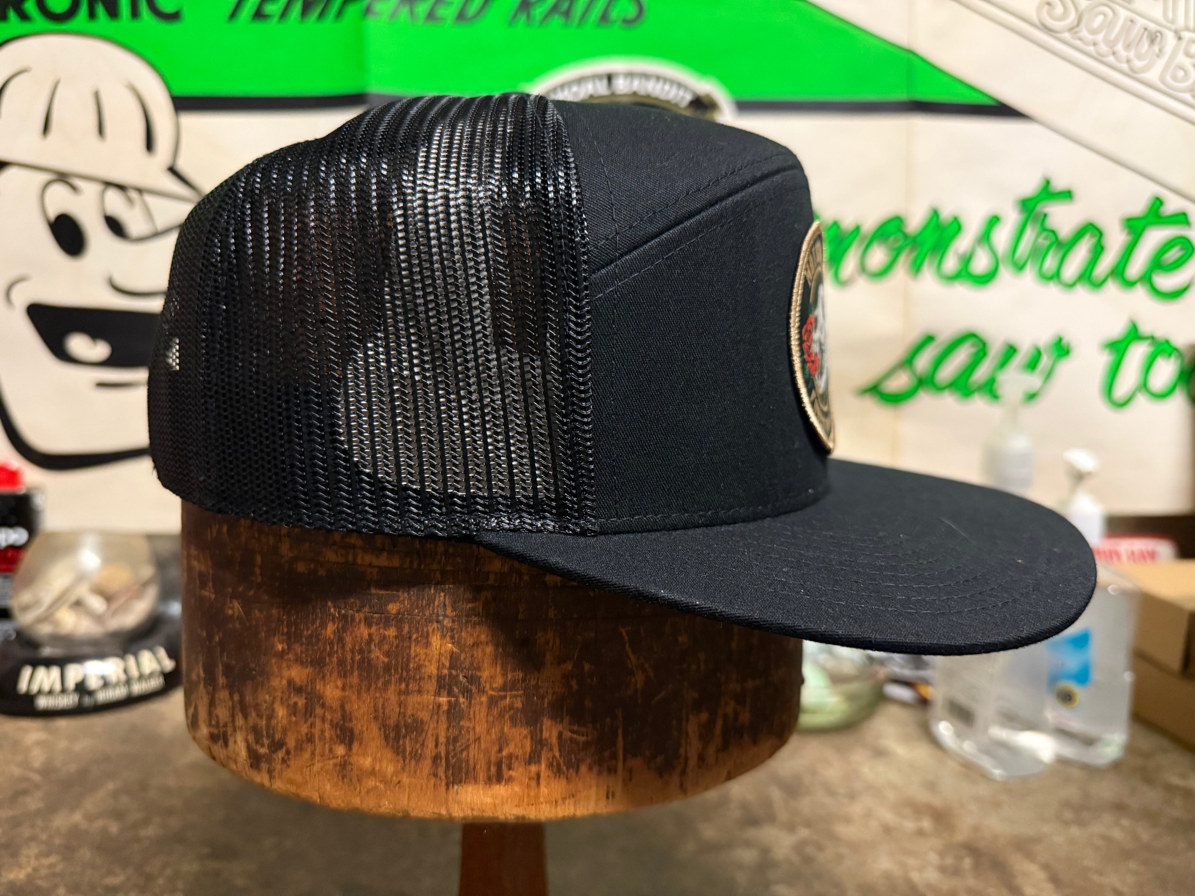 Salt Creek Black 7 panel trucker hat